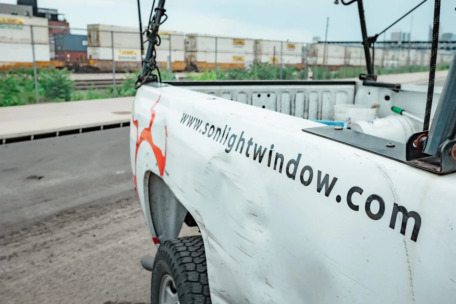 Sonlight Window Cleaning service truck branded with the company logo — Thornton, Colorado