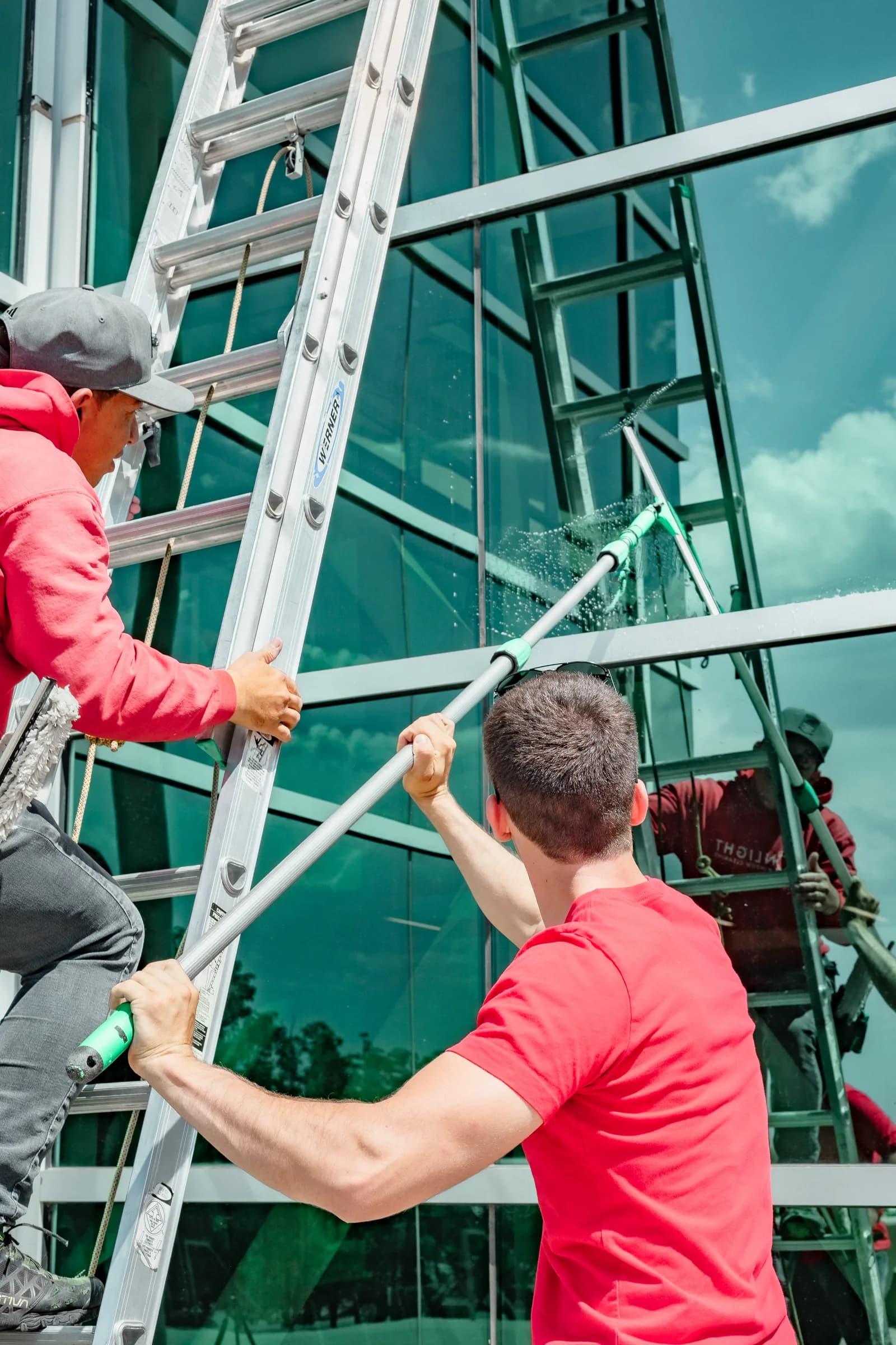 Sonlight crew member working on commercial glass in Denver — Parker, Colorado
