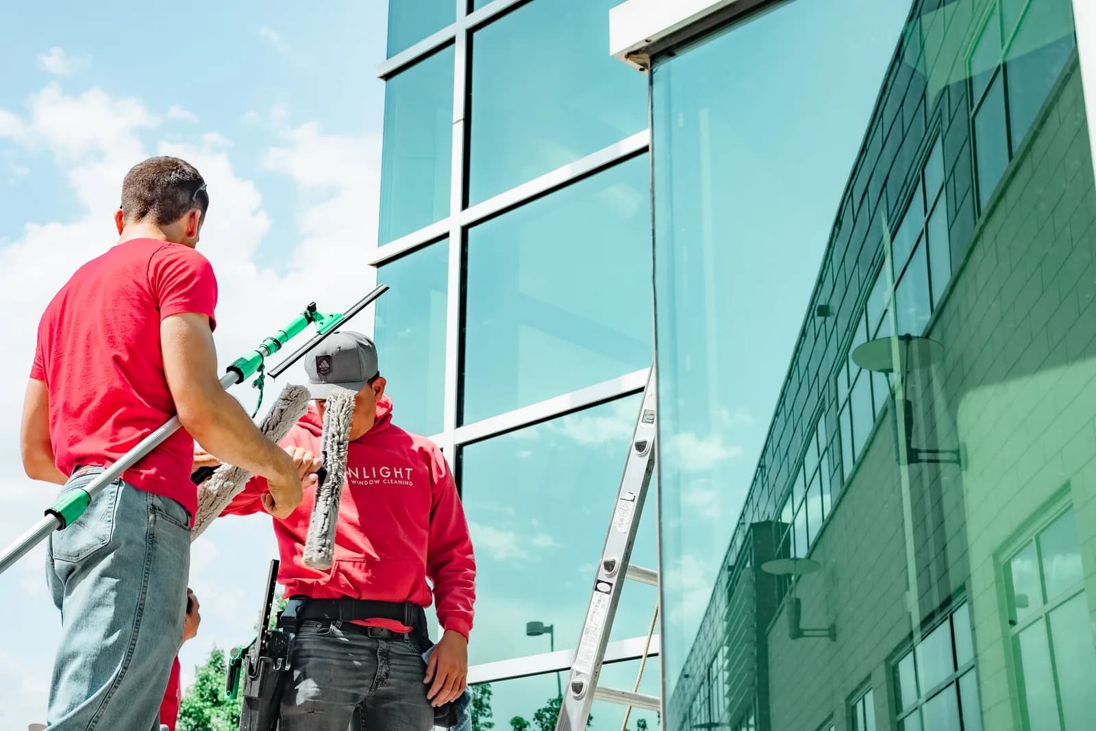 Sonlight team detailing commercial windows on a Colorado building — Commerce City, Colorado