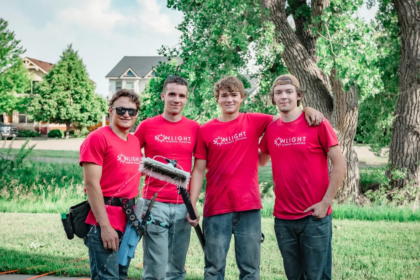 Four Sonlight Window Cleaning technicians posing at a Colorado residential job — Fort Collins, Colorado